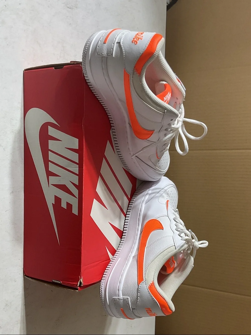 Nike Kids White Sneakers with Orange Accents
